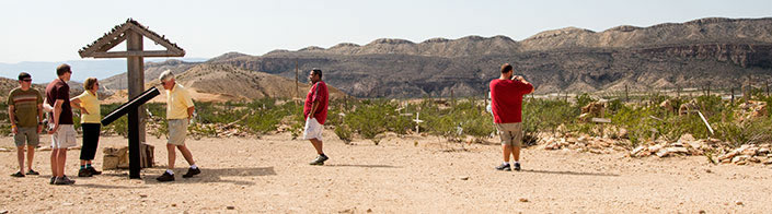 Visitors explore the cemetery.